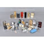 A collection of approximately 40 lighters, various manufacturers and designs, all AF
