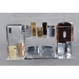Three cigarette combination cases with lighters, including Ronson Magnacase, Polo and one other,