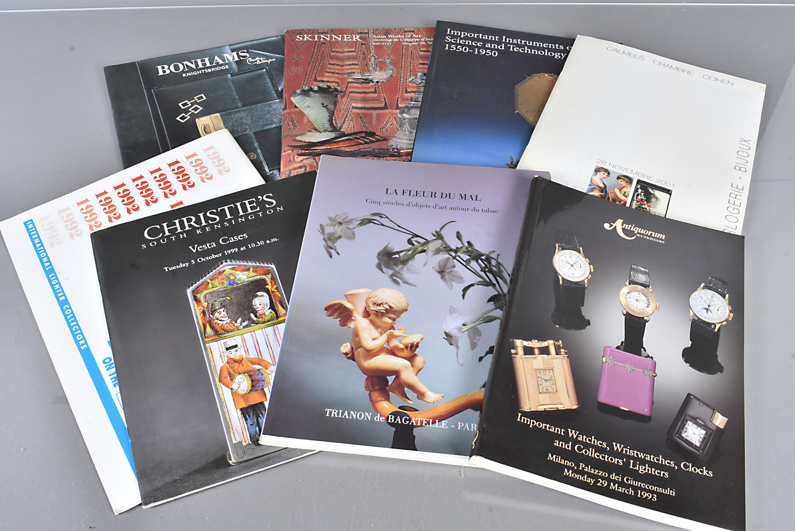 Seven Auction Catalogues, including rare Antiquorum Lighter and Watches sale dated March 1993,