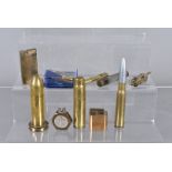 A group of ten Trench Art and brass lighters, including a Strom lighter, an one made of a 1942