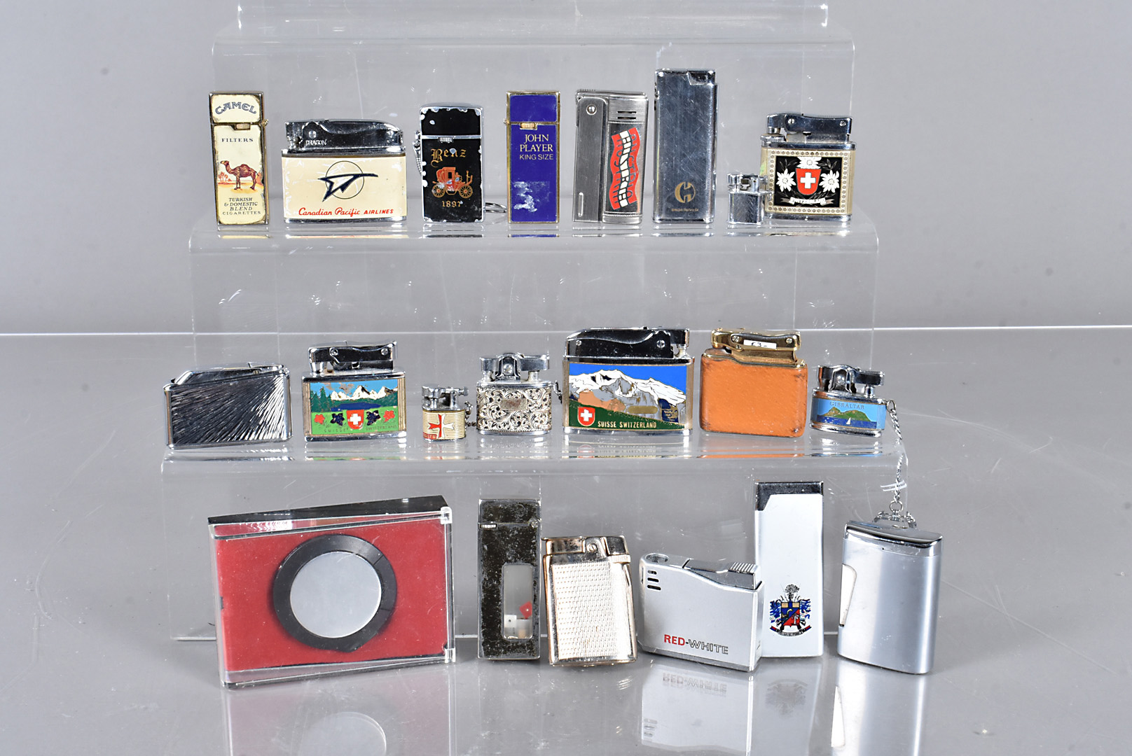 A collection of Advertising lighters, together with a selection of spare lighter parts (parcel)