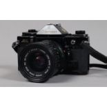 A Canon A-1 SLR Camera, serial no 2079456, body P-F, well-used body, brassing to edges, missing