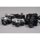 A Group of 35mm Cameras, an Olympus OM-10, with F Zuiko 50mm f/1.8 lens, a Yashica Electro 35 GTN, a