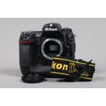 A Nikon D2H DSLR Camera body, serial no 2011756, body G, scratches to base, with body cap, strap,