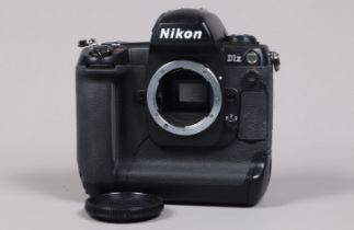 A Nikon D1x DSLR Camera Body, serial no 5015143, body G, light wear, with body cap, display screen