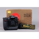 A Nikon D2H DSLR Camera body, serial no 2036285, body G, some wear, with body cap, display screen