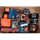 A Camera Collection, comprising two Kodak Retina II Type 142 rangefinder cameras, a Minox A
