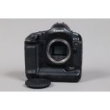 A Canon EOS-1 Ds Mark II DSLR Camera Body, serial no 319701, body G, some wear to edges, with body