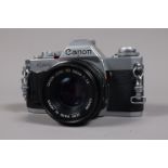 A Canon AV-1 SLR Camera, shutter working, meter responsive, self timer working, body G-VG, light