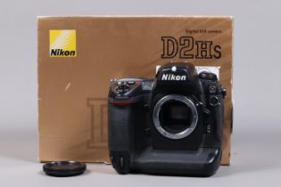 A Nikon D2Hs DSLR Camera Body, serial no 3007784, body G, some scratches to edges, with unbranded