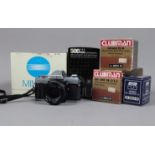 A Minolta X-300 SLR Camera Outfit, comprising an X-300, serial 1079679, body F-G, shutter working,