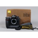 A Nikon D2H DSLR Camera body, serial no 2027315, body G, some wear, with body cap, strap, manual,