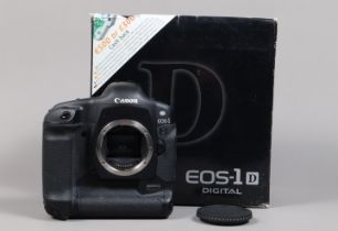A Canon EOS-1 D DSLR Camera Body, serial no 028648, body G, light wear, with strap, leather grip,