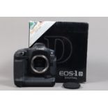 A Canon EOS-1 D DSLR Camera Body, serial no 028648, body G, light wear, with strap, leather grip,