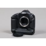 A Canon EOS-1 D DSLR Camera Body, serial no 009787, body G, light wear, with body cap, battery and