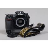 A Nikon D2x DSLR Camera Body, serial no 5030770, body G, some wear, with body cap, strap, battery