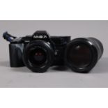 A Minolta 7000 AF SLR Camera and Accessories, serial no 21022341, body G, some whitening to front
