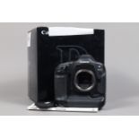 A Canon EOS-1 D DSLR Camera Body, serial no 005377, body G, light wear, with leather grip,body