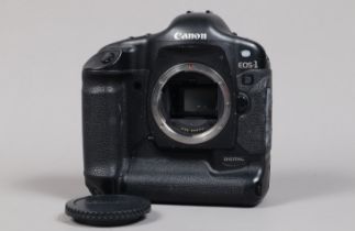 A Canon EOS-1 D DSLR Camera Body, serial no 015653, body G, some scratches to base, some wear to