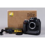 A Nikon D2x DSLR Camera Body, serial no 5040382, body G, some wear, with body cap, strap, cables,