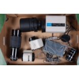 A Tray of Lenses for Canon SLR Cameras, a Sigma Mirror-Telephoto 600mm f/8 lens, hood, a set of