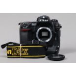 A Nikon D2x DSLR Camera Body, serial no 5013521, body G, light scratches, some wear to base, with