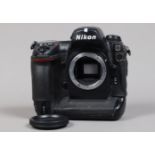 A Nikon D2x DSLR Camera Body, serial no 5003355, body F, missing leatherette to memory card