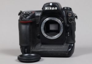 A Nikon D2x DSLR Camera Body, serial no 5003355, body F, missing leatherette to memory card