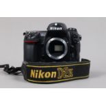 A Nikon D2H DSLR Camera body, serial no 2036416, body Gsome wear, light scratches to base, with body