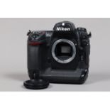 A Nikon D2x DSLR Camera Body, serial no 5003336, body G, light wear, with body cap, battery and MH-