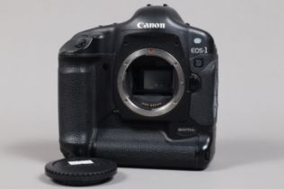 A Canon EOS-1 D DSLR Camera Body, serial no 009727, body G, some scratches to base, with body cap,