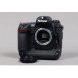 A Nikon D2x DSLR Camera Body, serial no 5067236, body G, missing leatherette on memory card cover,