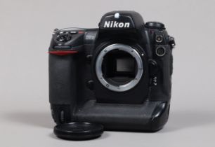 A Nikon D2x DSLR Camera Body, serial no 5067236, body G, missing leatherette on memory card cover,
