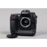 A Nikon D2H DSLR Camera body, serial no 2014874, body G, some wear, with unbranded body cap, battery