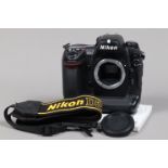 A Nikon D2Xs DSLR Camera Body, serial no 6003291, body G, some wear to edges, with body cap, display