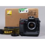 A Nikon D2x DSLR Camera Body, serial no 5043913, body G, light wear, with body cap, strap, manual,