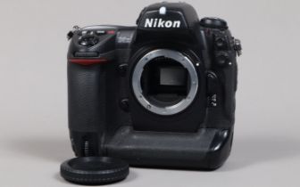 A Nikon D2x DSLR Camera Body, serial no 5028378, body G, light wear, with body cap, display screen