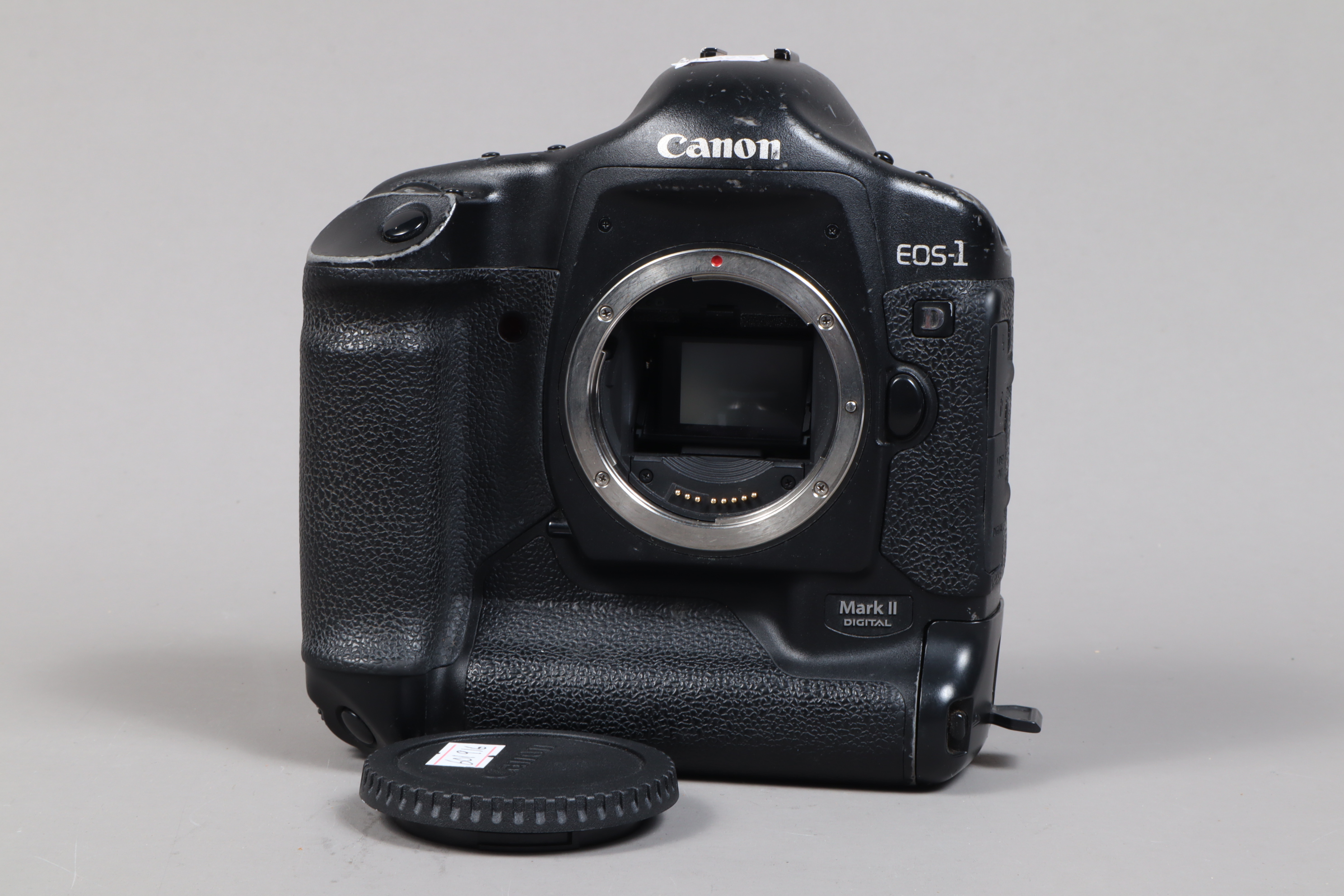 A Canon EOS-1D Mark II DSLR Camera Body, serial no 205068, body F-G, some wear to edges, with body