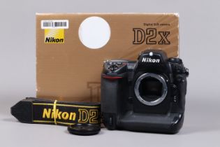 A Nikon D2x DSLR Camera Body, serial no 5075495, body G, some wear, missing leatherette from