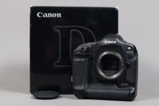 A Canon EOS-1 D DSLR Camera Body, serial no 016436, body G, light wear, with body cap, battery,