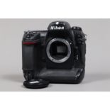 A Nikon D2Hs DSLR Camera Body, serial no 3002457, body F, wear and scratches, with battery and MH-21