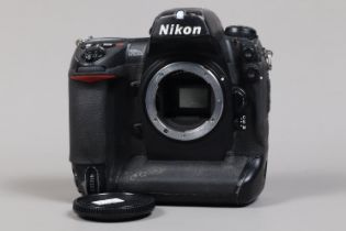 A Nikon D2Hs DSLR Camera Body, serial no 3002457, body F, wear and scratches, with battery and MH-21