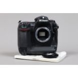 A Nikon D2H DSLR Camera body, serial no 2008285, body G, some wear, with body cap, manual, battery