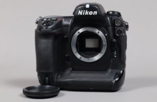 A Nikon D2Hs DSLR Camera Body, serial no 3007623, body G, some scratches to base, some wear, with