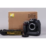 A Nikon D2x DSLR Camera Body, serial no 5046148, body G, some wear, with body cap, strap, battery,