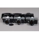 Three Canon Pellix SLR Cameras, comprising two Pellix cameras, serial no 115607 and 143860, with