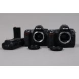 Two Nikon DSLR Bodies, a Nikon D70s, serial no 8034530 and a Nikon D70, bodies F, slight tackiness