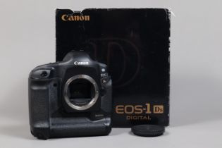 A Canon EOS-1 DS DSLR Camera Body, serial no 119984, body G, light wear, with body cap, strap,