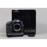 A Canon EOS-1 DS DSLR Camera Body, serial no 119984, body G, light wear, with body cap, strap,