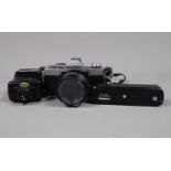 A Minolta XG 2 SLR Camera, not working, with Minolta MD Rokkor 50mm f/1.4 lens, serial no 3360232, a